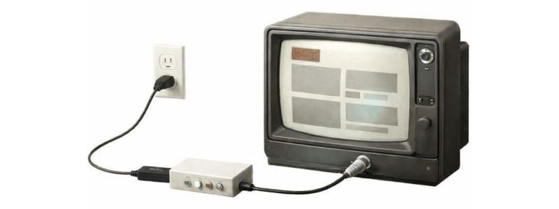Old TV connected to a streaming device using an HDMI-to-RF converter and coax cable.